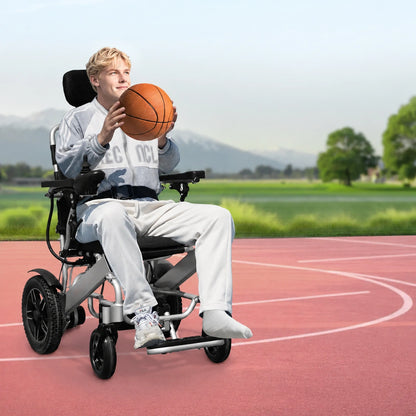 adult using lightweight electric wheelchair outdoors for mobility assistance